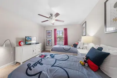 a bedroom with two beds and a ceiling fan at Paradise 4Bd w Private Pool & Waterpark 8951 in Kissimmee