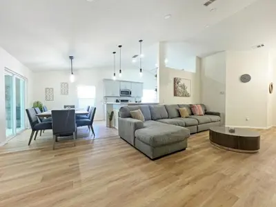 a living room with a couch and a table at Magical Dreams home in Kissimmee