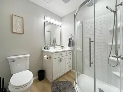 a bathroom with a toilet and a shower and a sink at Magical Dreams home in Kissimmee