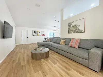 a living room with a couch and a coffee table at Magical Dreams home in Kissimmee