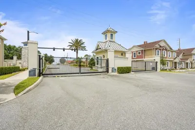 a house with a gate and a church at Sunrise Shores townhouse in Orlando