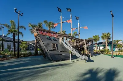 a playground in a park with a slide at Casa 5Q c/ Piscina Privativa - Storey Lake Resort in Kissimmee