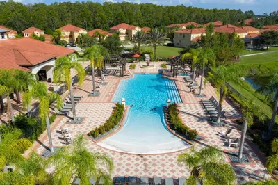 an overhead view of a swimming pool at a resort at Cozy Townhouse with Private Pool in Kissimmee in Kissimmee