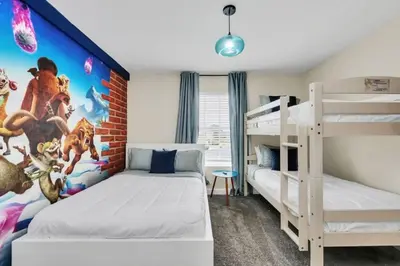a bedroom with two bunk beds and a mural at Retreat & Relax Screened In Pool Home Kid Rooms townhouse in Kissimmee
