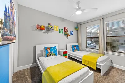 a bedroom with two beds and a window at Gated community 4BD townhouse next to Disney in Kissimmee
