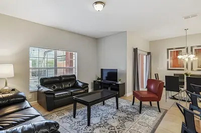 a living room with a couch and a table at Casa Familiar c Piscina Privativa Paradise Palms in Kissimmee