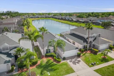 an aerial view of a house with a swimming pool at 3 Bedrooms 2 Bathrooms Lake Berkley home in Kissimmee