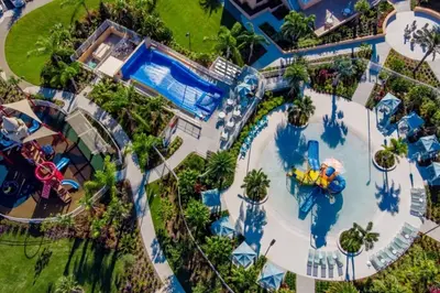 an overhead view of a water park with a pool at 5 Bedrooms 5,5 Bathrooms Solara home in Orlando