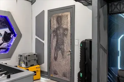 a door with a drawing on it in a room at 9 Bed Storey Lake Star Wars Dream Home home in Kissimmee