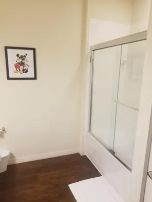 a bathroom with a glass shower and a toilet at 3 Bed 2 Bath Condo in Lucaya Village Near Disney townhouse in Kissimmee