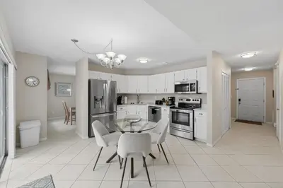 a kitchen with a table and chairs in a room at Ultimate Resort Gateway in Orlando