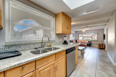 a kitchen with a sink and a counter top at Spacious Casselberry House with Backyard Pool in Orlando