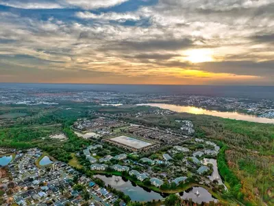an aerial view of a city with a lake at Bright Modern Townhome Retreat in Kissimmee