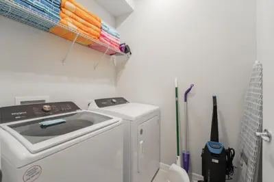 a washer and dryer in a small bathroom at New 2025 Bambi Orlando Pool Vacation Home in Clermont