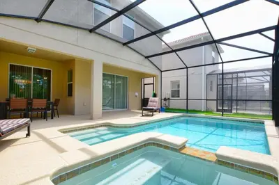a swimming pool in a house with a glass ceiling at Florida Dreaming home in Kissimmee