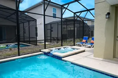 a swimming pool in front of a house at Gorgeous 5BR at Storey Lake next to Disney - 2924 in Kissimmee