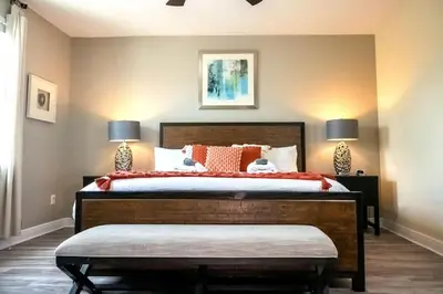 a bedroom with a large bed with two lamps at Gorgeous 8BR PetFriendly at Encore Resort next to Disney - 7625 in Orlando