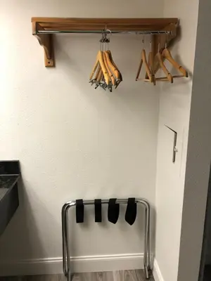 a wall with a rack of baseball bats at Green Palms Extended Stay in Kissimmee