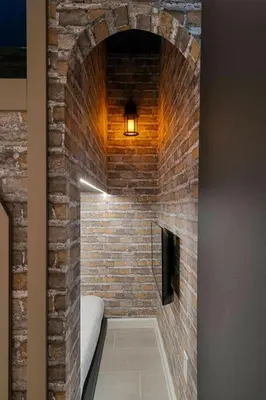 a brick hallway with a bed in a brick wall at Orlando Paradise 5BR Themed Home in Orlando
