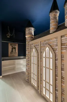 a room with a brick wall and arched windows at Orlando Paradise 5BR Themed Home in Orlando
