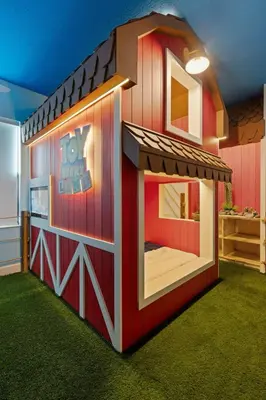 a toy house is shown in a room at Themed 15BR Mansion - Near Parks in Kissimmee