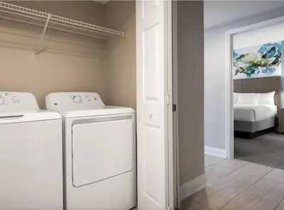 a laundry room with a washer and dryer at Weekly rental at Orange Lake Resort for a family of 8 people in Orlando
