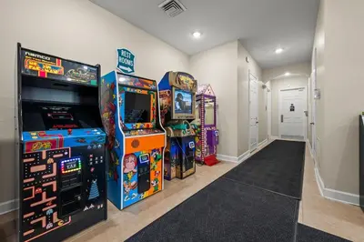 a room with two arcade machines and two video games at Spacious Home Perfect for Big Families in Kissimmee