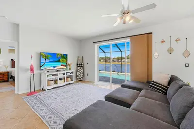 a living room with a couch and a ceiling fan at 2989 - Flamingo Farmhouse in Kissimmee