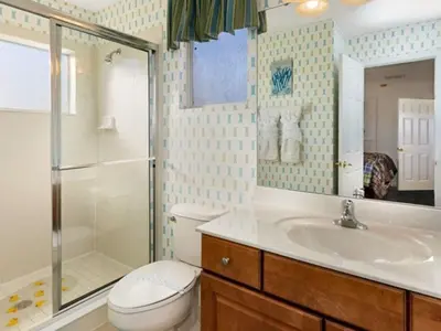 a bathroom with a toilet and a shower and a sink at Holiday Home Bella Vida Resort Pool und Spa Rückzugsort by Interhome in Kissimmee