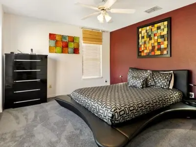 a bedroom with a bed and a ceiling fan at Holiday Home Bella Vida Resort Pool und Spa Rückzugsort by Interhome in Kissimmee