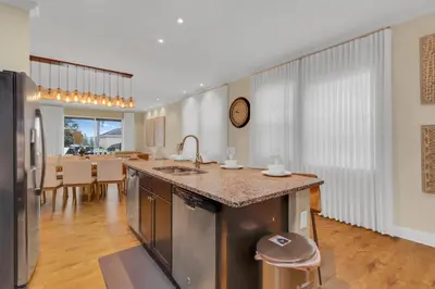 a kitchen with a sink and a counter top at Unforgettable 8-Bedroom Luxury Retreat in Orlando
