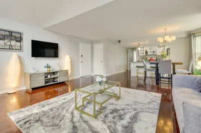 a living room with a couch and a table at Villa at Laguna Bay in Kissimmee