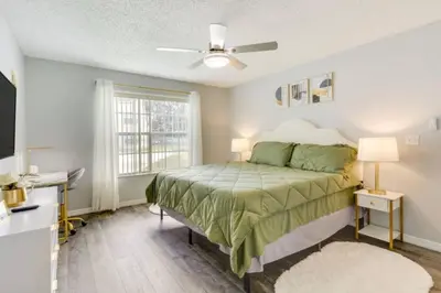 a bedroom with a bed and a window at Villa at Laguna Bay in Kissimmee
