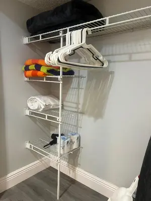 a closet with a white shelf and some towels at Condo Universal Disney Epic Free Parking in Orlando