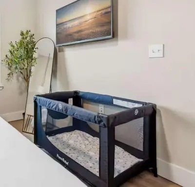 a dog bed in the corner of a room at Riviere 2BR Apartment Pet Friendly Oasis Sleeps 6 Close to Epic Universe Pool & Gym in Orlando