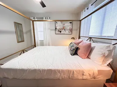 a bedroom with a bed with two pillows on it at Cozy Modern 3BR Escape - Sanford in Sanford