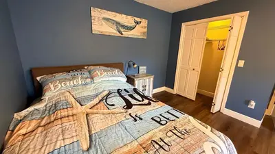 a bedroom with a bed with a starfish on it at The little Manatee Apartment in Orlando