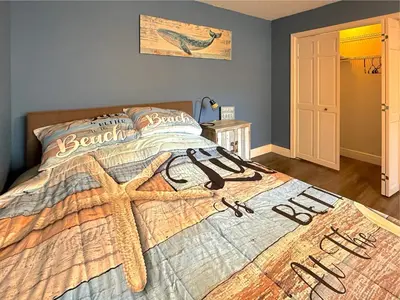 a bedroom with a bed with a baseball comforter at The little Manatee Apartment in Orlando