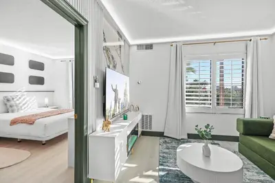 a living room with a bed and a couch at Cozy 1BR near Universal International Drive in Orlando