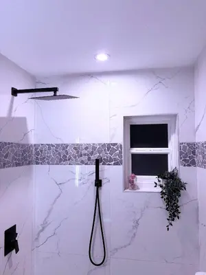 a white bathroom with a shower with a window at Game Day Getaway-Downtown Orlando in Orlando