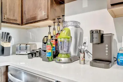 a kitchen counter with a blender on top of it at FREE Shuttle & 50 Dollars Disney Gift Card Disney Resort Condo in Orlando