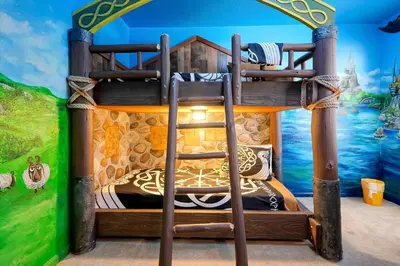 a childrens bedroom with a bunk bed in a room at Themed Villa with Private Pool, Game Room, Resort Amenities, BBQ in Orlando
