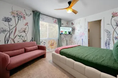 a bedroom with a bed and a couch at Themed Villa with Private Pool, Game Room, Resort Amenities, BBQ in Orlando