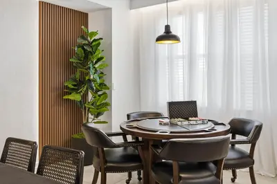 a dining room with a table with chairs and a laptop at 207 Storey Lake 6 Guests 2 BDRS near clubhose in Kissimmee
