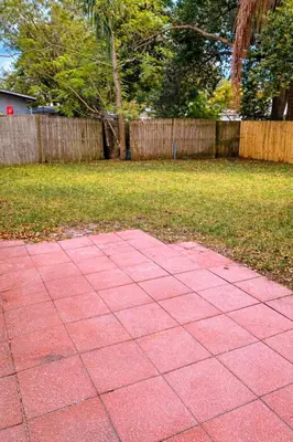 a pink sidewalk in the middle of a yard at Spacious Casselberry Home Near Attractions in Orlando