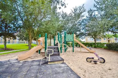 a playground in a park with a slide at Private Pool 3BR Resort Villa near Disney in Kissimmee