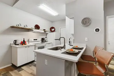 a kitchen with a sink and a counter top at Restpool vibes, Nest tree-ish Retreat- NxtDisney in Kissimmee
