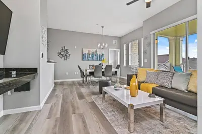 a living room with a couch and a table at Sunset every single day ReserveView 4BRElevator in Kissimmee