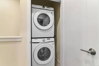 a washing machine and a washer in a room at Discover paradise - NEW! Pool House Next to Disney in Orlando