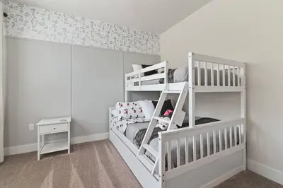 a childs room with a white bunk bed at Discover paradise - NEW! Pool House Next to Disney in Orlando